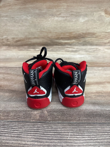 Rear view of Air Jordan Jumpman Pro TD Bred sneakers in size 4c on a wooden background.