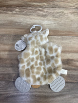 Plush giraffe baby toy with clip and textured teether feet on wood background
