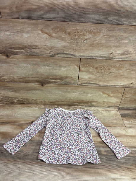 Carter's floral waffle knit henley shirt in white, size 4T, on a wooden background