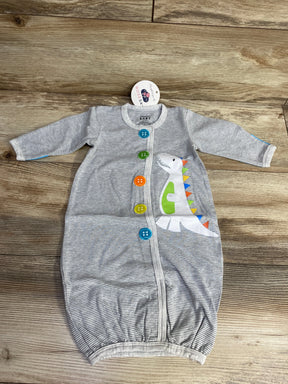 Gray striped baby sleeved sleeper with colorful buttons and cute dinosaur graphic on wood background