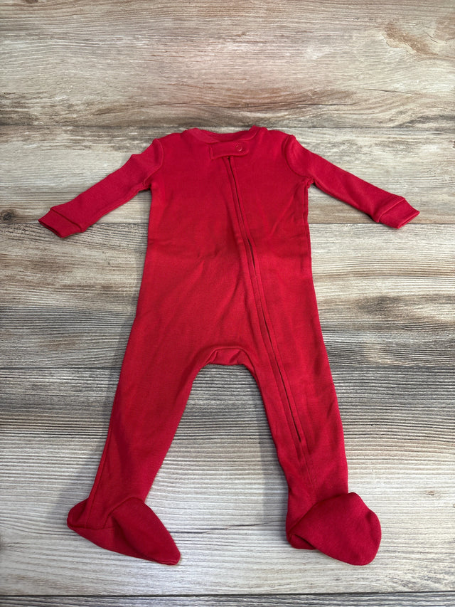 Red baby footed sleeper with long sleeves and zipper on wooden background