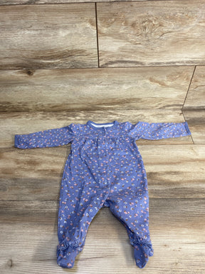 Purple floral long sleeve baby romper on wood background