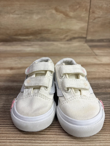 Front view of Vans Old Skool V Floral Cream sneakers showcasing double hook and loop straps and floral accents on a wood floor