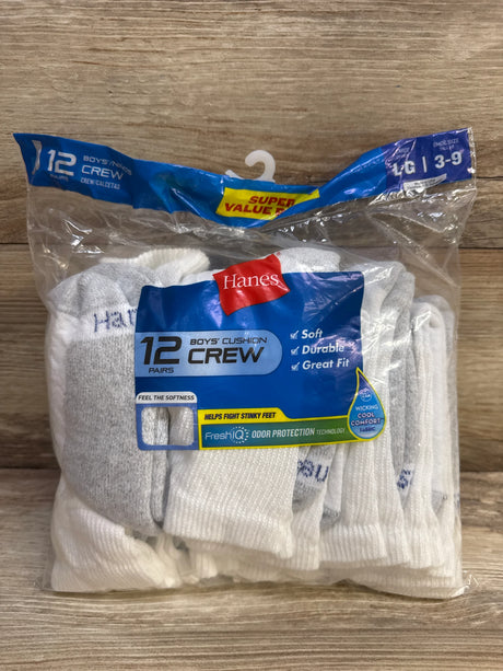 Front of Hanes boys’ white cushioned crew socks, 12 pairs in packaging showing FreshIQ odor protection