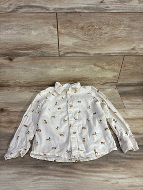 White long-sleeve kids shirt with brown deer print, button-front, laid on wood floor