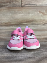 Front view of See Kai Run Tenny toddler sneakers in pink showing velcro strap and white elastic laces on wood grain surface
