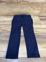 Back view of Children's Place ponte knit pull-on jeggings in tidal navy, size 5T, showing back pockets on wood floor