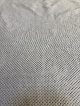 Close-up of soft gray waffle knit textured fabric for kids clothing or baby gear