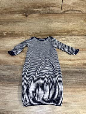 Striped long sleeve baby gown with navy and white pattern on wooden background