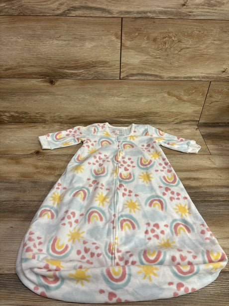Front view of Just One You blanket sleep sack showcasing long sleeves, front zipper, rainbow and sun pattern on a wood background