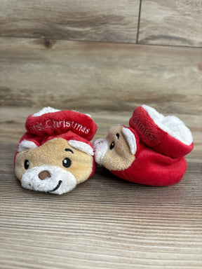 Red plush baby booties with 'First Christmas' text and reindeer face design