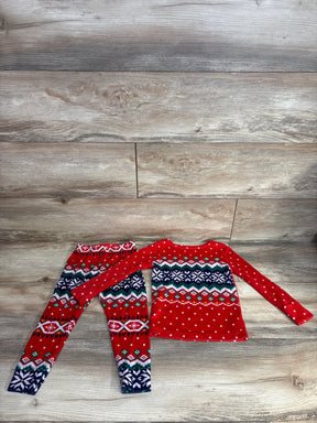 Red holiday kids pajama set with festive snowflake patterns, perfect for cozy winter nights.
