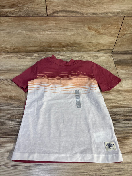 Top-down of maroon and white Oshkosh 5T hooded shirt with ombre stripes, brand patch and size stickers on wood floor