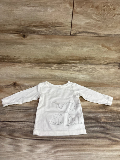 Front view of Carter’s white long sleeve shirt in size 3m showcasing elephant embroidery on a wood-grain background