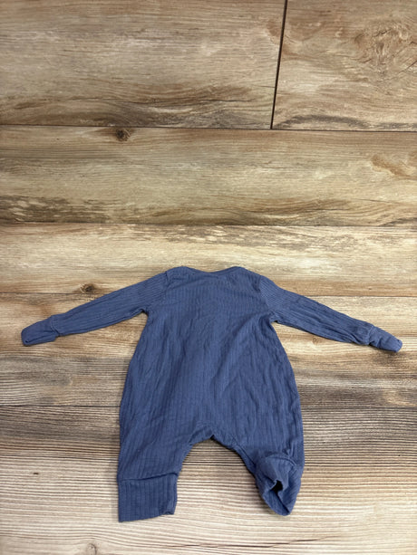 Front view of Modern Moments blue footless viscose sleeper in newborn size showcasing ribbed texture on a wood background