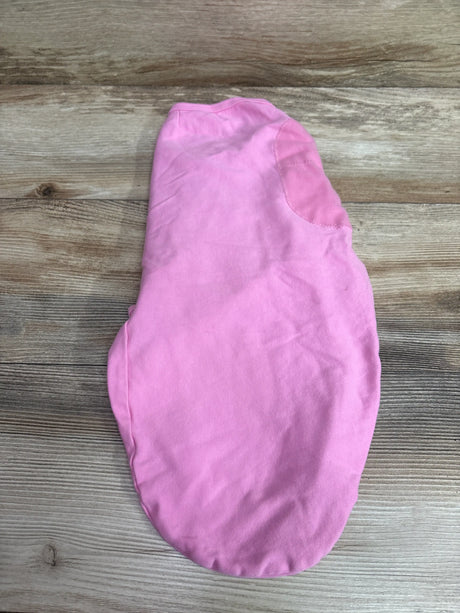 Pink SwaddleMe baby swaddle wrap, size 0-3 months, on a wooden background.