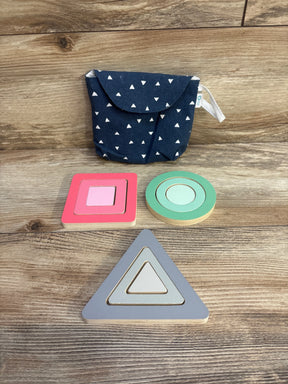 Front view of KiwiCo Panda Crate shape puzzle showcasing nested triangle, circle, and square wooden pieces with navy patterned pouch on wood background