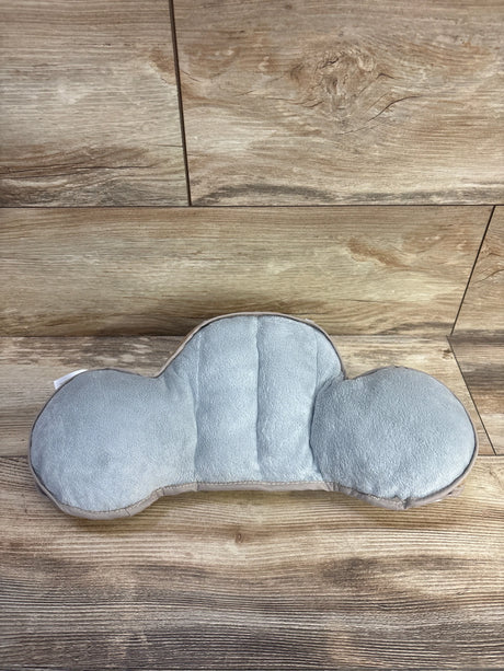 Top view of Taf Toys tummy time support pillow with grey plush cloud shape and raised side bolsters on wood background