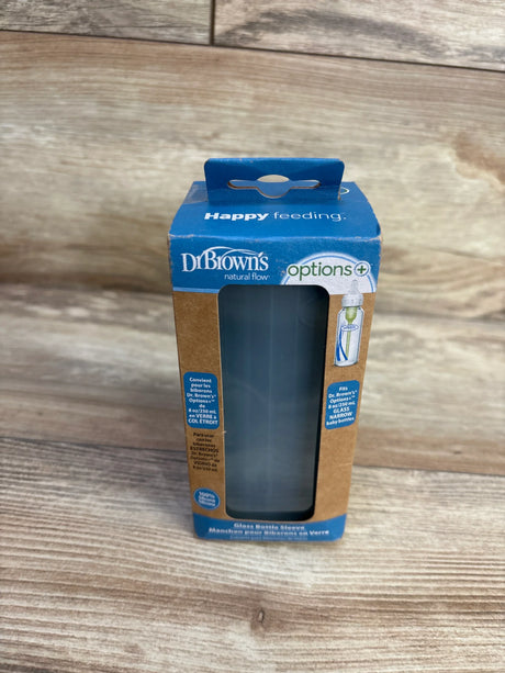 Front view of Dr. Brown's Options+ narrow 8 oz glass bottle sleeve in retail box showing gray sleeve through clear window on wood background