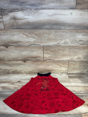 Front flat-lay of girls' red Minnie Mouse x Pirates of the Caribbean dress showing central pirate Minnie graphic and black collar on wood floor