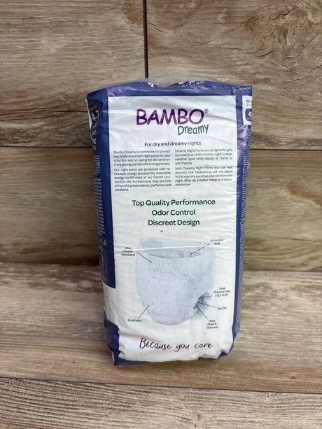 Front view of Bambo Dreamy Night Pant youth training pants showing absorbent channels on a wood-look background