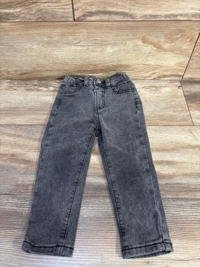 Flat-lay of grey toddler jeans size 2-3T showing straight legs, elasticized waist and front pockets on wood floor background