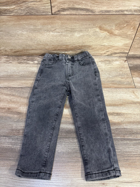 Flat-lay of grey toddler jeans size 2-3T showing straight legs, elasticized waist and front pockets on wood floor background
