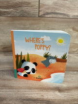 Front cover of KiwiCo Where's Poppy board book showing panda with red bag and hippo on sandy beach, wood tabletop background