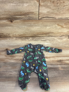 Front view of preemie grey footed sleeper showcasing colorful dinosaur print and front zipper on wooden background