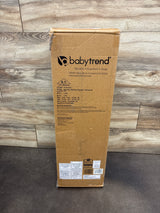 Front view of Baby Trend Nursery Center Playard Tanzania packaging showing product labeling on a wood floor