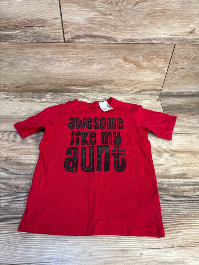 Red kids graphic t-shirt with 'awesome like my aunt' text, laid on wood floor