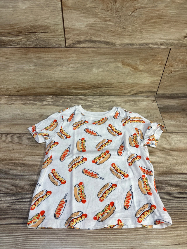 Flat lay of Old Navy toddler white t-shirt showing all-over hot dog and corn dog print on wood background