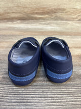 Navy blue Mayoral baby shoes with checkered lining on a wood surface