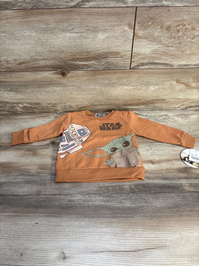 Brown toddler Star Wars sweatshirt with R2-D2 and Baby Yoda on wooden background