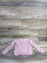 Back flat-lay of H&M light pink long-sleeve toddler shirt showcasing crew neckline and long sleeves on wood floor