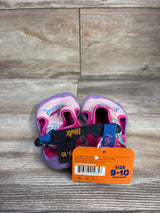 Front view of Newtz mermaid water shoes in pink and purple showing mermaid graphic, strap and size 9-10 tag on wood