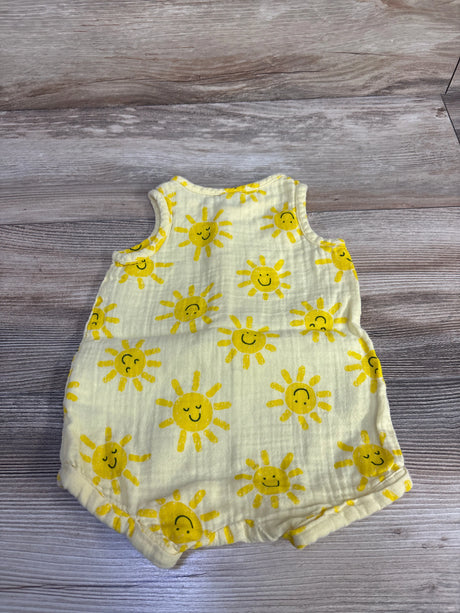 Flat lay of Old Navy sleeveless henley baby romper in sunshine yellow showing smiling sun print on wood background