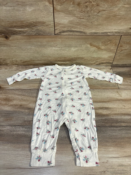 Front view of ivory floral footless viscose sleeper with long sleeves and front zipper on wood flooring