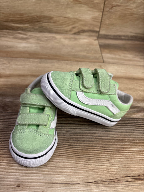 Angled view of Vans Old Skool V Lime Burst Green sneakers showcasing two hook-and-loop straps on a wood floor