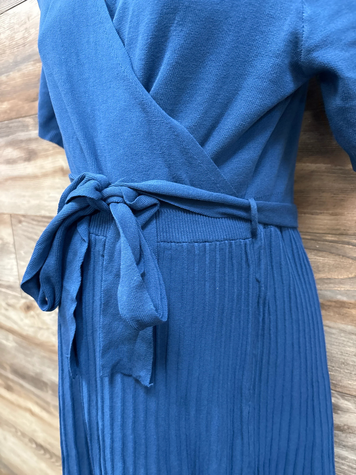 Blue maternity wrap dress with tied waist and ribbed texture