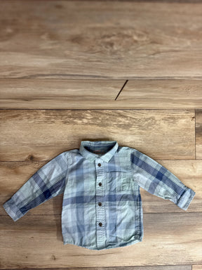 Flat lay of toddler blue plaid Cat and Jack button up shirt showing front buttons, chest pocket, and long sleeves on wood floor