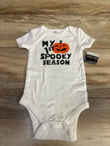 White baby onesie with 'My 1st Spooky Season' and pumpkin design for Halloween.