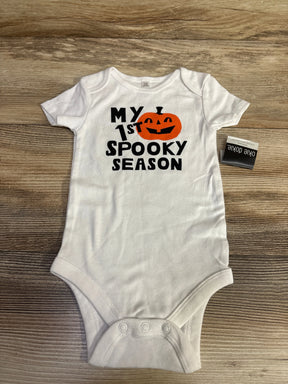 White baby onesie with 'My 1st Spooky Season' and pumpkin design for Halloween.