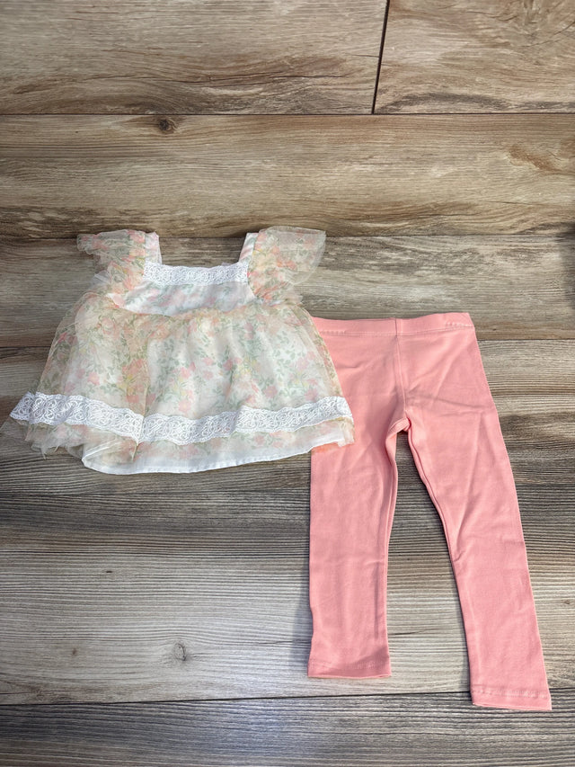 Girls floral lace ruffle top with pink leggings set on wood background