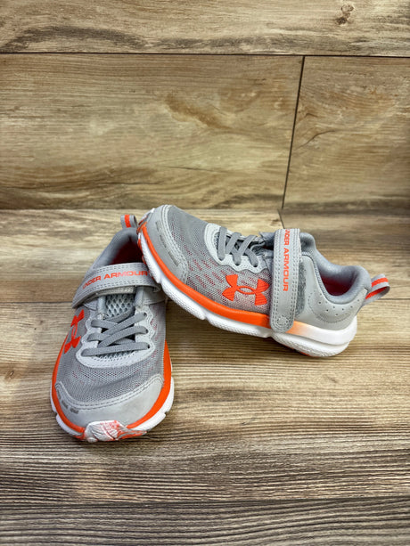 Front and side views of Under Armour Assert 10 alternate closure sneakers with gray mesh, orange accents, and hook-and-loop straps