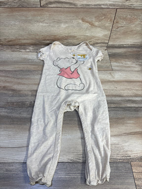Front flat lay beige Disney Baby Winnie the Pooh jumpsuit 18m showing hunny-pot graphic and snap leg closures