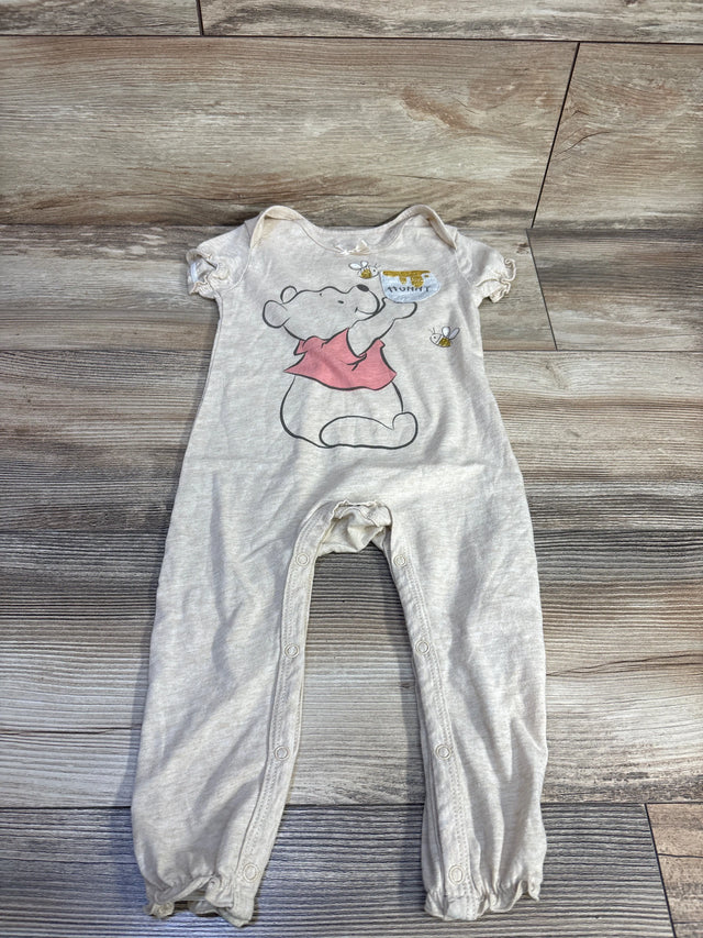 Front flat lay beige Disney Baby Winnie the Pooh jumpsuit 18m showing hunny-pot graphic and snap leg closures
