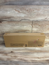 Brown cardboard toy box with manufacturer labeling on wood surface, unopened packaging