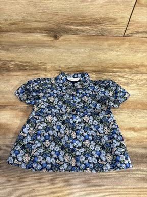 Blue floral baby dress with puff sleeves, button front, Janie and Jack brand, laid on wood floor