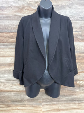 Black open front blazer with cuffed sleeves on mannequin, wood background